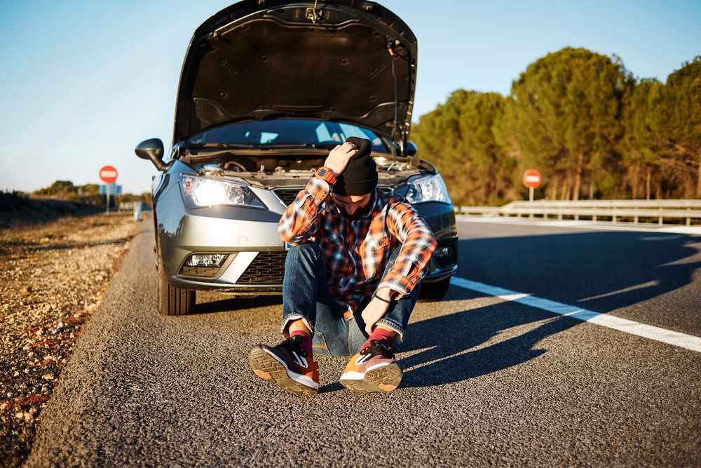 car-man-sits-near-the-broken-automobile-sad-and-u-2025-01-24-02-27-18-utc (1)