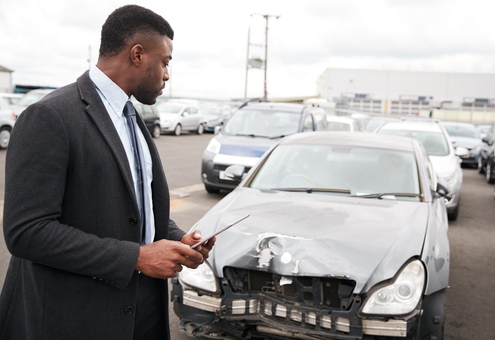 male-insurance-loss-adjuster-with-digital-tablet-i-2024-10-21-12-02-28-utc (1)